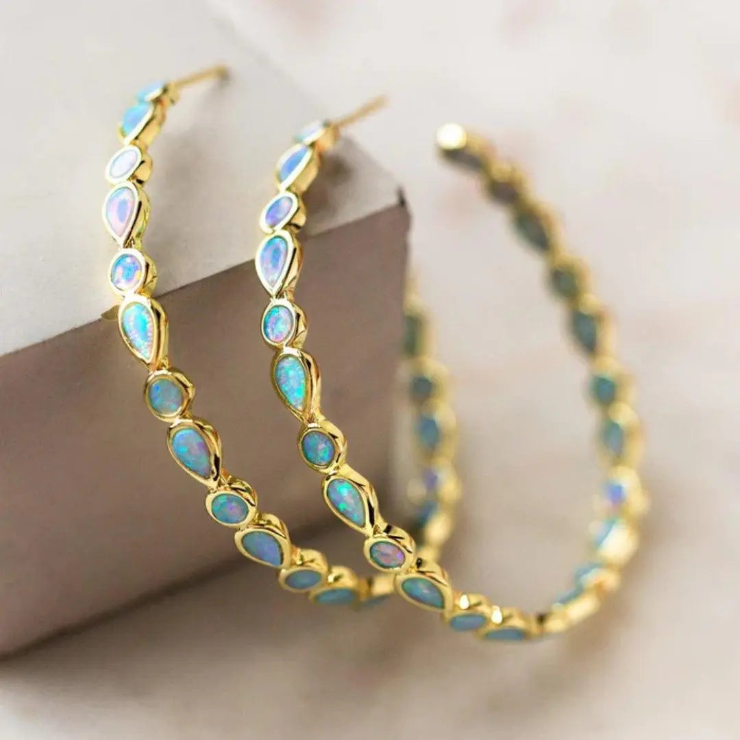 Boucles d'oreilles rétro en or et opale bleue