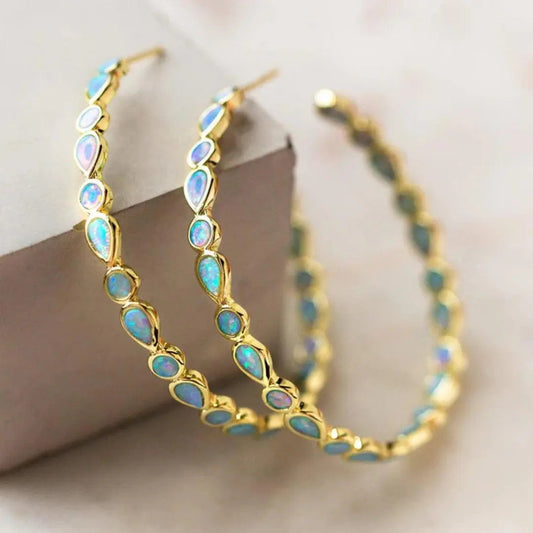 Boucles d'oreilles rétro en or et opale bleue